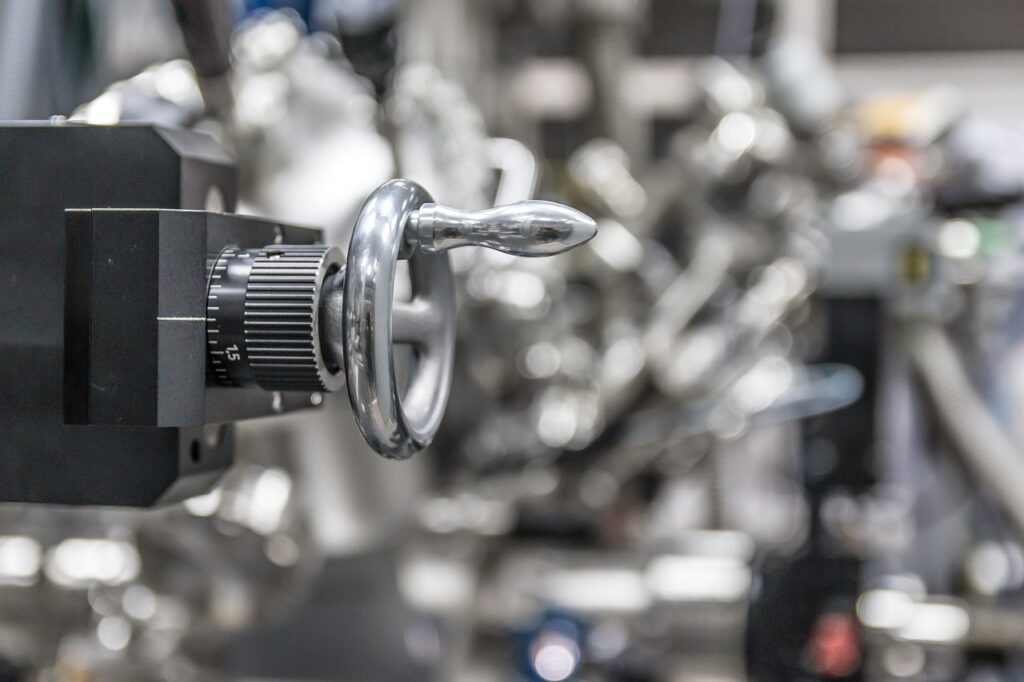 Plumbing fittings and controls, showcasing a close-up of a chrome valve handle and knob, representing reliable plumbing solutions in Utica.