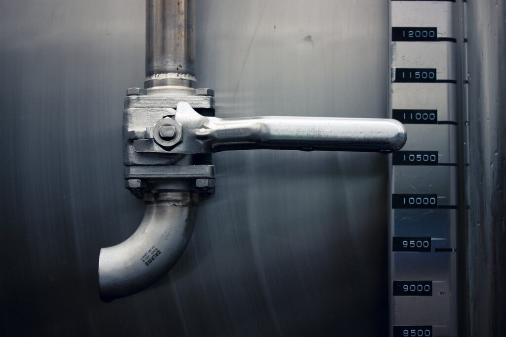 Pipe valve with a handle and measurement gauge, representing plumbing services and repair solutions by Frost & Kretsch Plumbing in Sterling Heights.