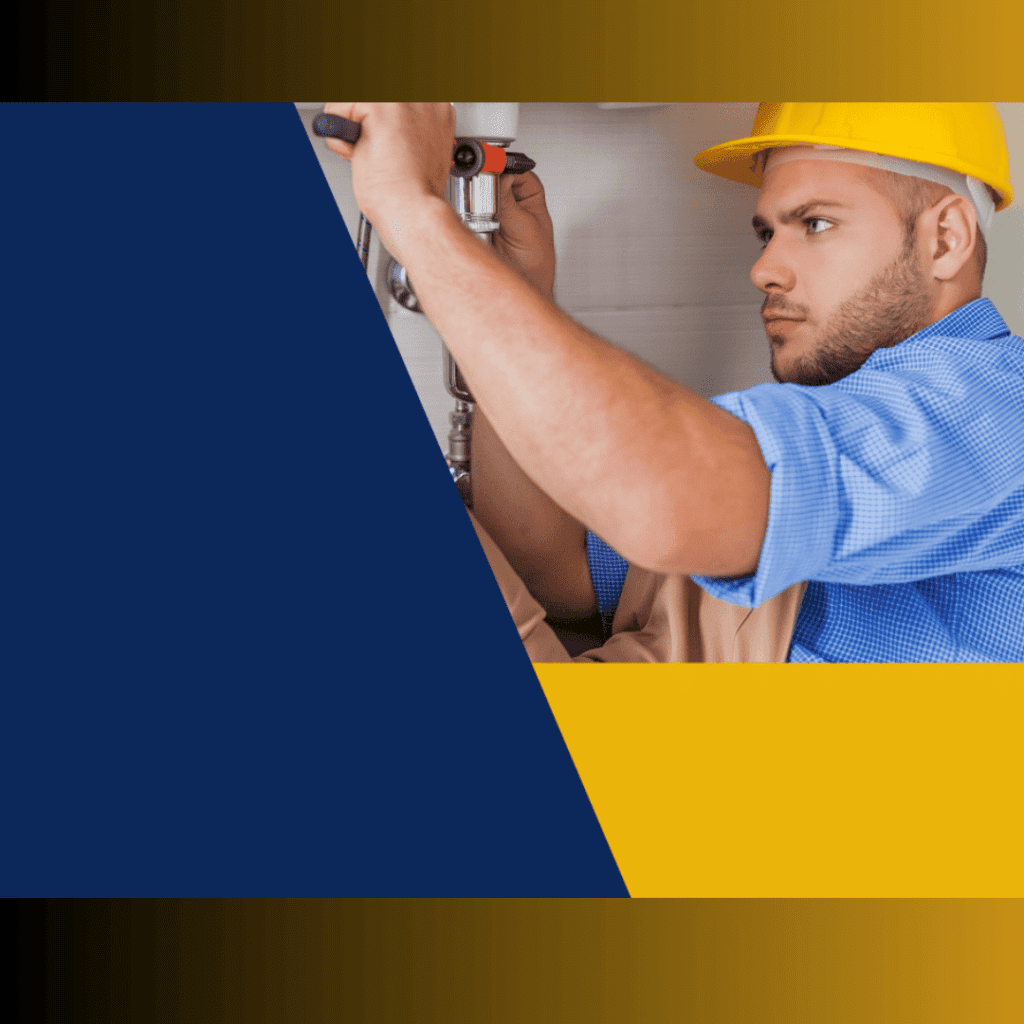 Plumber in blue shirt and yellow hard hat repairing plumbing, representing Frost & Kretsch Plumbing's services in Ray, Michigan.